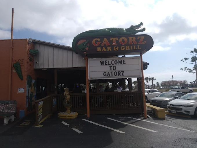 Gatorz Bar & Grill storefront in Port Charlotte with the iconic green gator sign